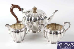 A hallmarked silver three piece tea set, by The Goldsmiths & Silversmiths Company Ltd.