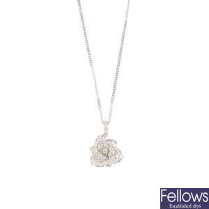 An 18ct gold diamond flower pendant, on chain.