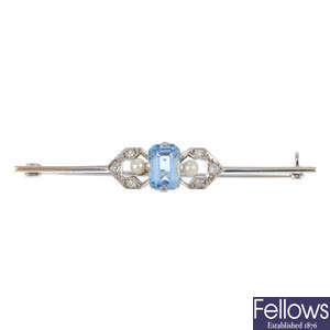 An aquamarine and diamond bar brooch.