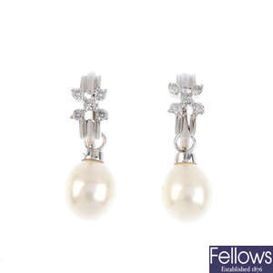 A pair of cultured pearl and diamond earrings. 