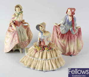 A group of six Royal Doulton figurines.