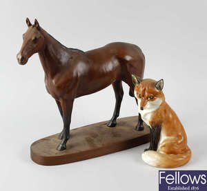 A Royal Worcester fox together with a Beswick horse.