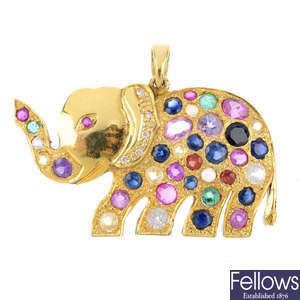 A gem-set elephant pendant.