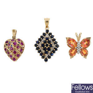 Eight diamond and gem-set pendants.