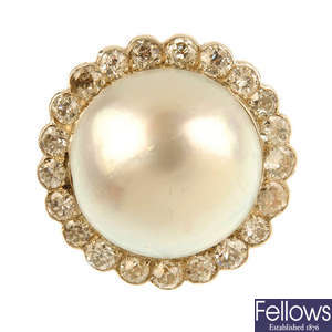 A mabe pearl and diamond cluster ring.