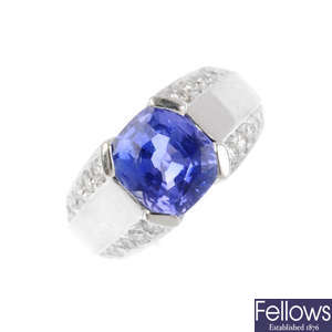A colour-change sapphire and diamond dress ring.