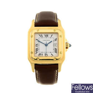 CARTIER - a yellow metal Santos wrist watch.