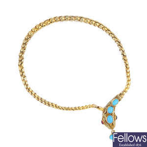 A late Victorian gold gem-set snake bracelet.