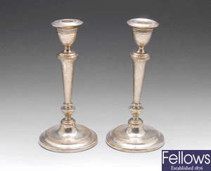 A pair of 1920's silver candlesticks.