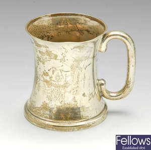 A 1920's silver christening mug, a sauce boat and cream jug. (3).