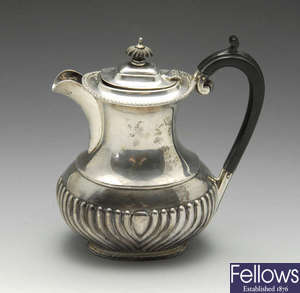 A 1920's silver hot water pot.
