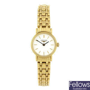 LONGINES - a lady's gold plated bracelet watch with Tissot bracelet watch.