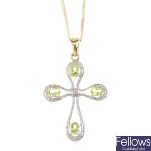 A 9ct gold diamond and peridot cross pendant, with 9ct gold chain.