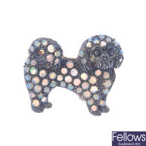 An opal dog brooch.