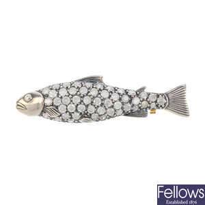 A diamond fish brooch.