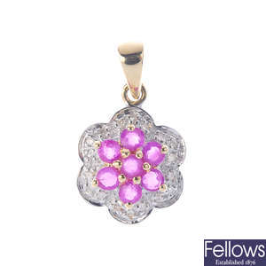 A 9ct gold diamond and ruby pendant, with chain.