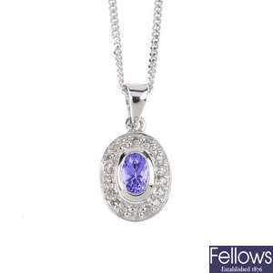 A tanzanite and diamond earrings and pendant set, with chain.