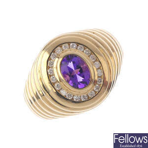 A 9ct gold amethyst and diamond cluster ring.