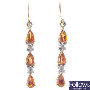 A pair of 9ct gold coated topaz and diamond earrings.