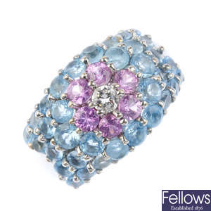 A diamond, sapphire and topaz dress ring.