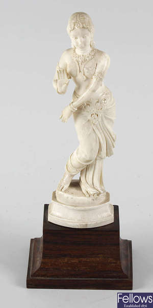 An ivory figure, modelled as a female Indian dancer.