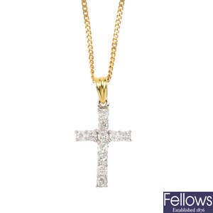 An 18ct gold diamond cross pendant.