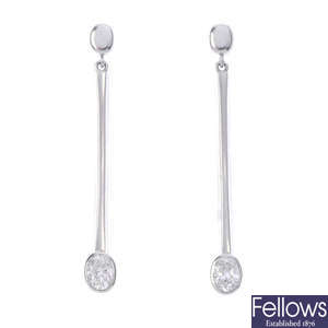 A pair of platinum diamond earrings.