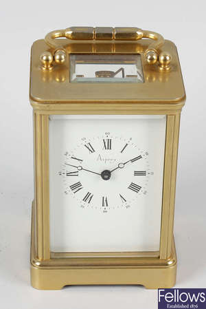 An 'Angelus' brass-cased carriage clock retailed by Asprey.