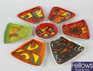 Fourteen various Poole pottery Delphis pattern trinket dishes.