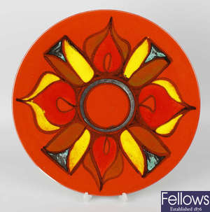 A Poole pottery Delphis pattern circular wall charger.