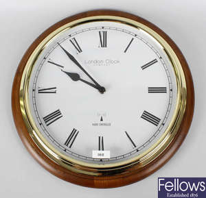 A selection of Seiko, London Clock Company and other wall clocks.