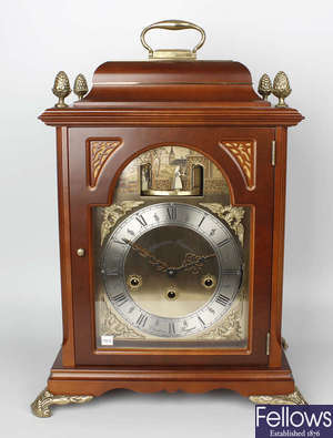 A Christian Huygens reproduction bracket clock, plus other examples.