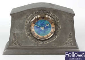 A Liberty & Co Tudric pewter and enamel mantel clock.