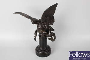 A 19th century bronze ornament modelled as an eagle with outstretched wings.