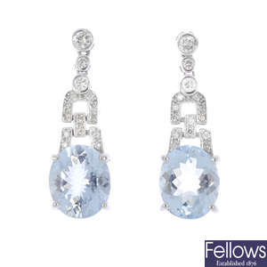 A pair of aquamarine and diamond earrings.