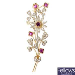 A ruby, diamond and seed pearl floral brooch.