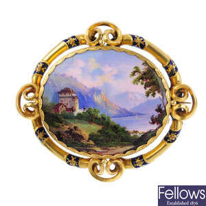 A mid Victorian gold and enamel landscape brooch.