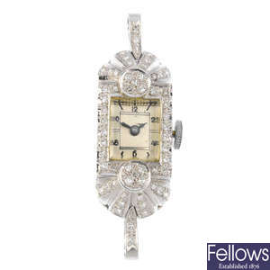 An Art Deco diamond watch head.