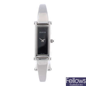 GUCCI - a lady's stainless steel 1500L bangle watch.