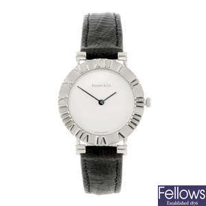 TIFFANY & CO. - a lady's white metal Atlas wrist watch.