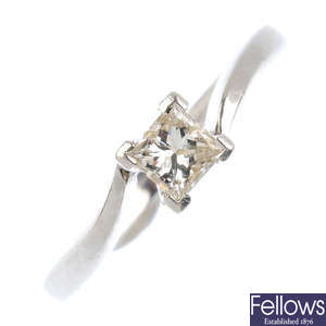 A platinum diamond single-stone crossover ring.