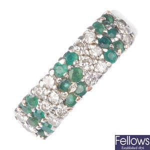 A diamond and emerald ring.