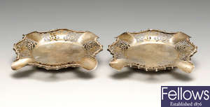 A George V pair of silver ashtrays.