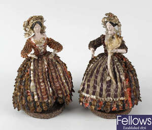 A pair of early 19th century shell decorated figurines.