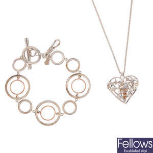 CLOGAU - two silver and gold items of jewellery. 