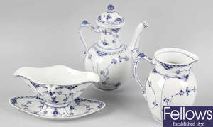 An extensive collection of Royal Copenhagen porcelain half-lace dinner and tea wares