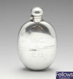 An Edwardian silver hip flask.