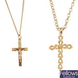 Two 9ct gold cross pendants, with chains.