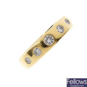 An 18ct gold diamond five-stone band ring.