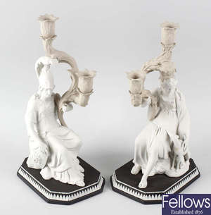 A superb pair of Wedgwood three-colour jasperware figural candelabra.